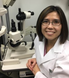 Dr. Hau smiling at the practice